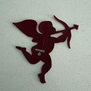 Hermes’ Petite h Leather ribbon charm Cupid Rare